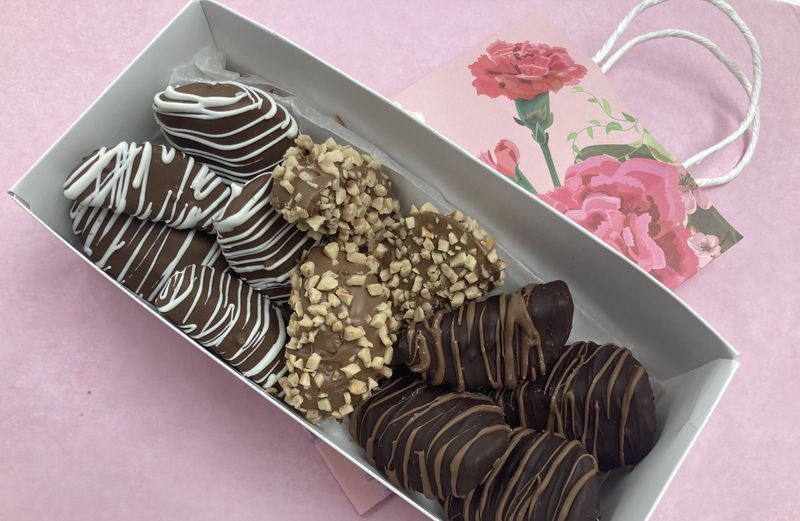 Box of Chocolate Covered Apples.  5 Milk with white drizzle, 4 Dark with milk drizzle and 3 Milk with Toffee.  Pick up at store only!