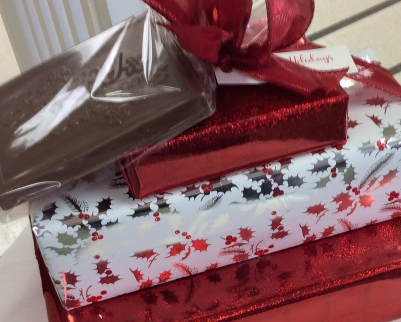 3 Tiered Chocolate Asst. Plus Holiday Greetings Milk Chocolate Bar. Boxed Assortments include 2 Lb. of Asst. Chocolates, 1.25 Lb. of Asst. 3 Ring Pretzels, 1/3 Lb. Mini Pretzels Assorted.