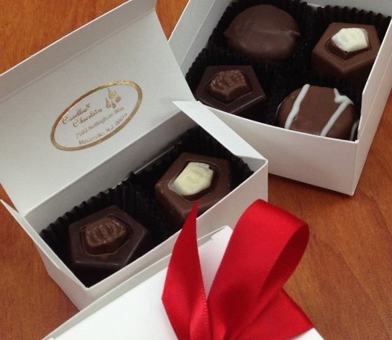 4 Piece Favor Box, 2 Buttercremes, 2 Truffles or 4 Truffles.  Choice of Ribbon Color.  Choose curl sheen or satin ribbon. Usually have in stock but give us a few days if possible.