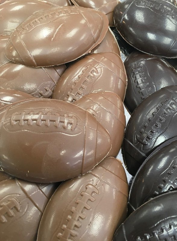 Solid Chocolate Footballs.  3"x2" approx.  Peanut and Gluten Free.  20 to a Lb.