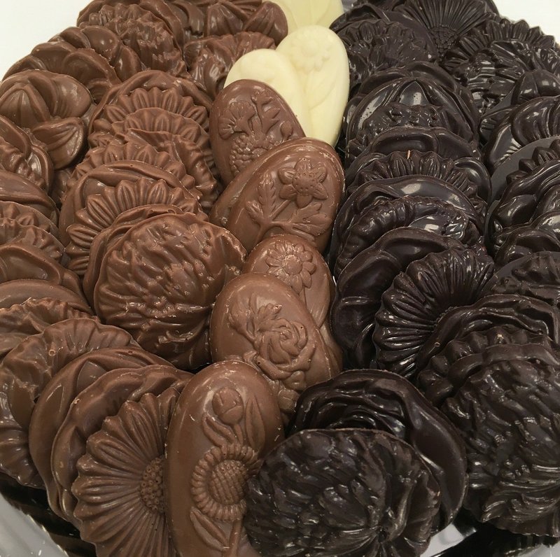 Assorted Solid Chocolate Flowers.  1 1/2" approx.  Peanut and Gluten Free.  52 to a Lb.