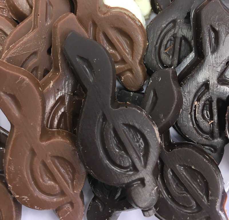 Solid Chocolate Musical notes. 1" x 2 3/4".  Peanut and Gluten Free.  36 to a Lb.