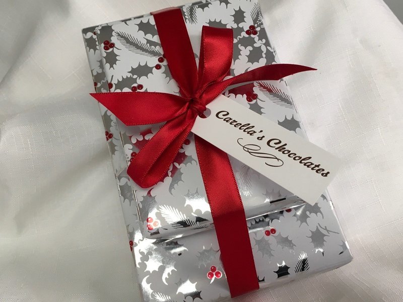 F - Two Tier Asst. Chocolates. 1 Lb. Assorted Chocolates, 1/2 Lb Asst. 3 Ring Gourmet Pretzels and 1/2 Lb. Assorted Mini Pretzels. Wrapped with Bow F - Two Tier Asst. Chocolates. 1 Lb. Assorted Chocolates, 1/2 Lb Asst. 3 Ring Gourmet Pretzels and 1/2 Lb. Assorted Mini Pretzels. Wrapped with Bow