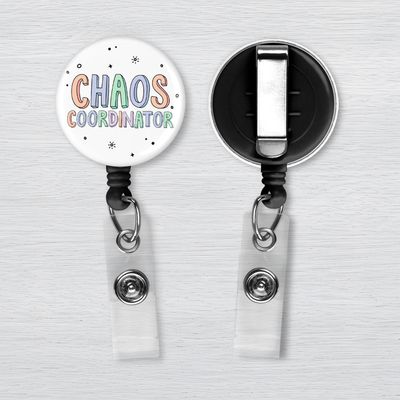 Chaos Coordinator Badge Reel | Nurse Gift White retractable badge reel with pastel “Chaos Coordinator” lettering and black accent dots displayed from the front & back.
