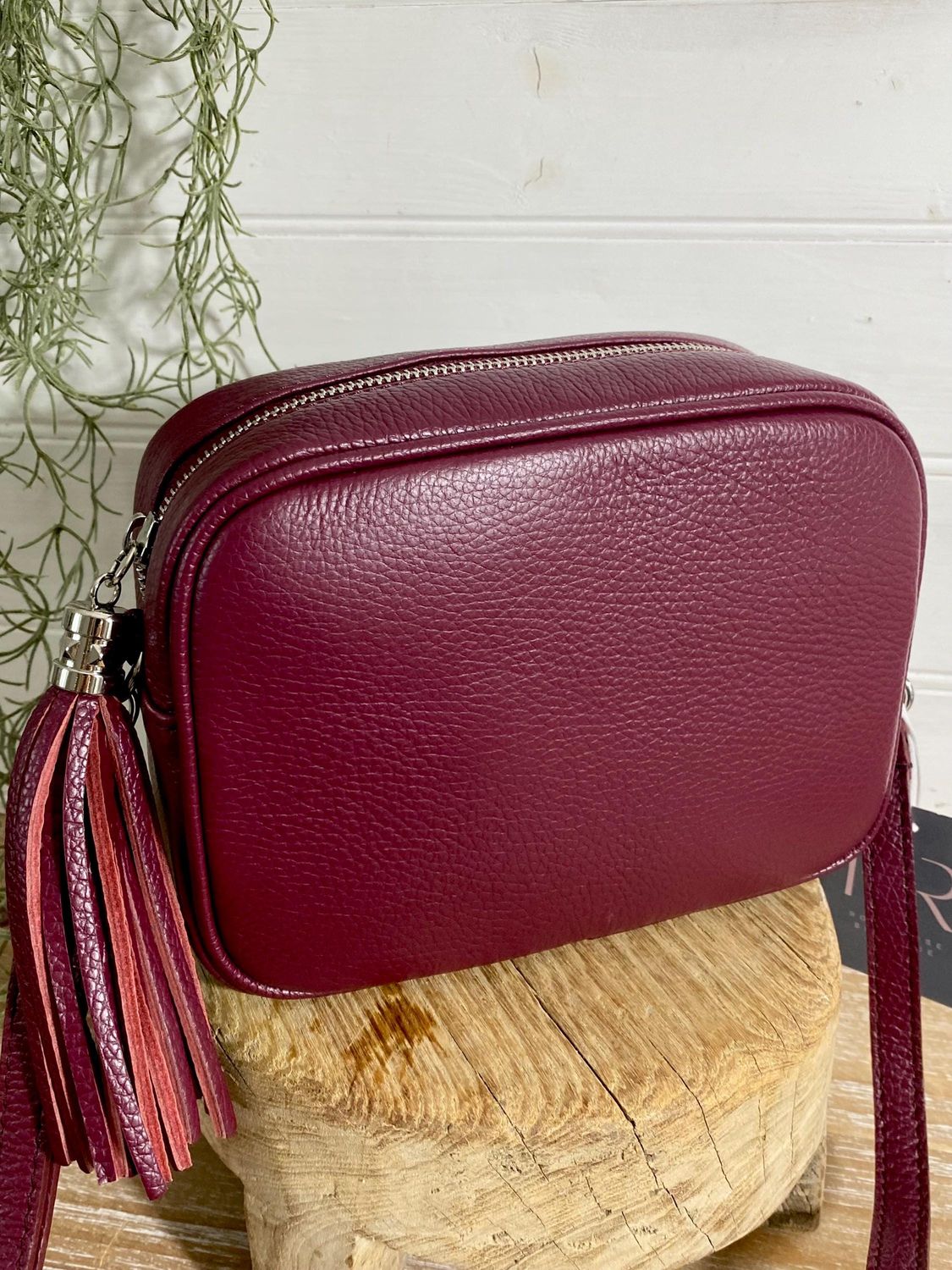maroon purse with tassel