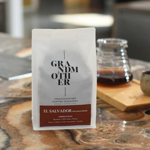 Grandmother Roastery El Salvador Bourbon Honey 250g Specialty Coffee bag on table with glass coffee…