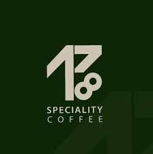 1718 Colombia Gesha Gold Natural specialty coffee branding, featuring the 1718 logo on a dark green…