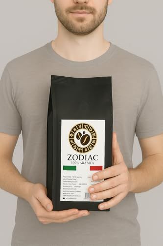 Man holding black bag of Zodiac Arabica Espresso Beans 1kg with white label and Italian flag, showc…