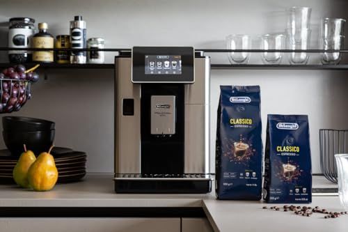 De'Longhi Classico Espresso Beans 250g bags on a kitchen counter with coffee machine, pears, and ki…