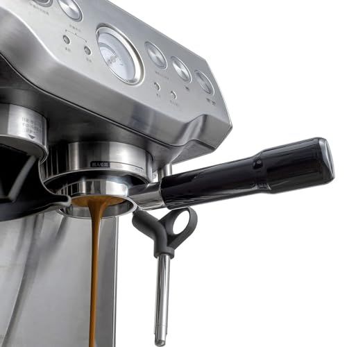 Breville espresso machine dispensing coffee, stainless steel body, black handle, control panel on t…