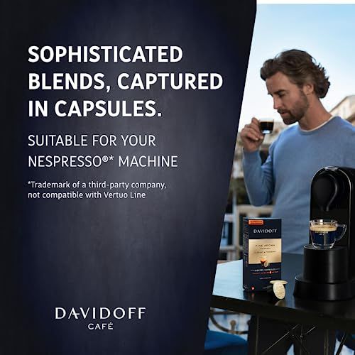 DAVIDOFF Fine Aroma Nespresso 10 coffee capsules on a table next to a Nespresso machine and a man h…