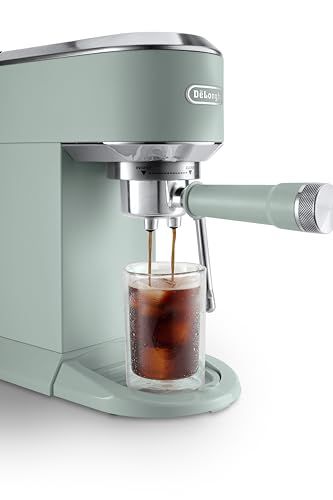 De'Longhi Dedica Duo EC890 Green coffee machine dispensing coffee into a glass with ice cubes on a …