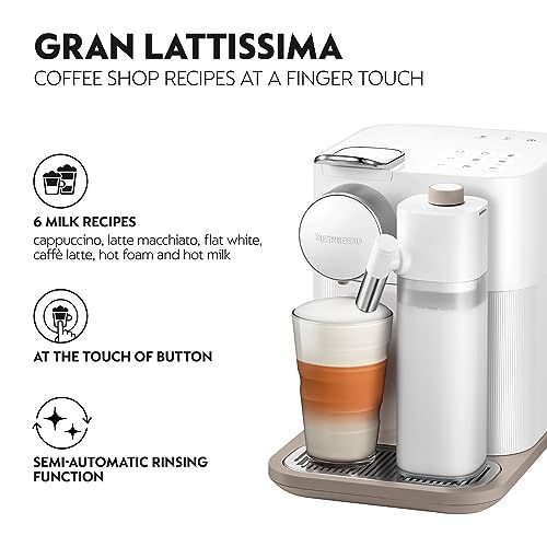 De'Longhi Gran Lattissima EN640 White coffee machine with milk frothing and a glass of layered coff…