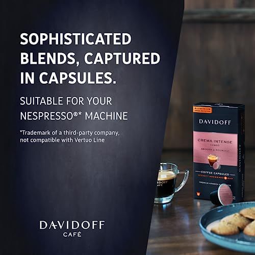 DAVIDOFF Crema Intense Nespresso 10 coffee capsules box on a table with a cup of coffee and plate o…