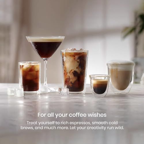 Kouch KEC1984 Espresso machine with glasses of various coffee drinks.