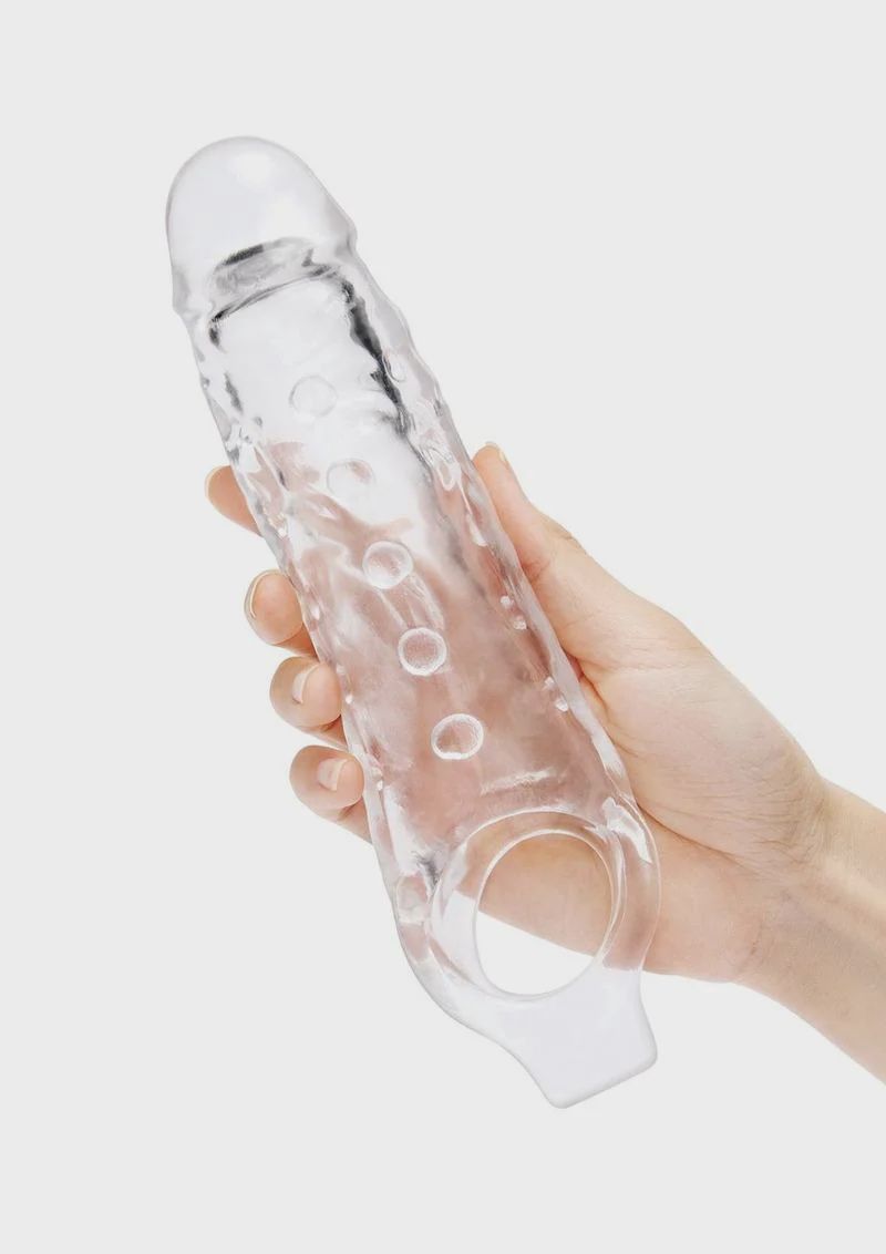 SU 1 IN. SEE-THRU STUDDED PENIS EXTENDER W/ BALL LOOP