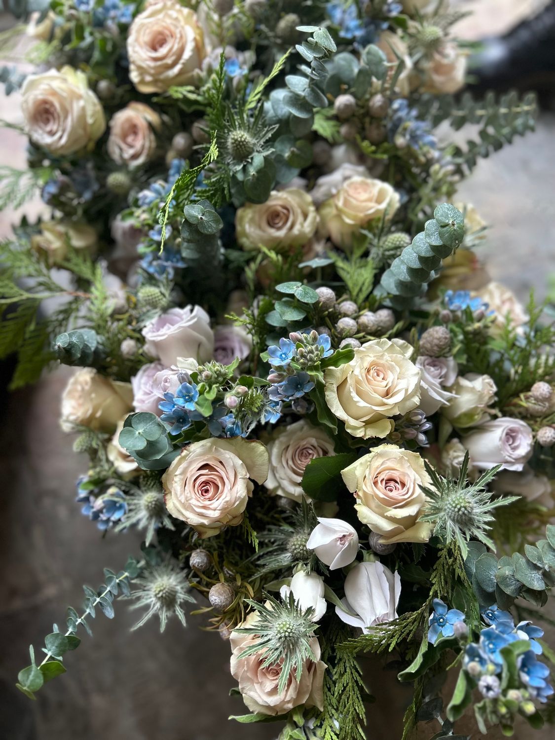 WINTER ROSES AND THISTLE HANDTIED BOUQUET