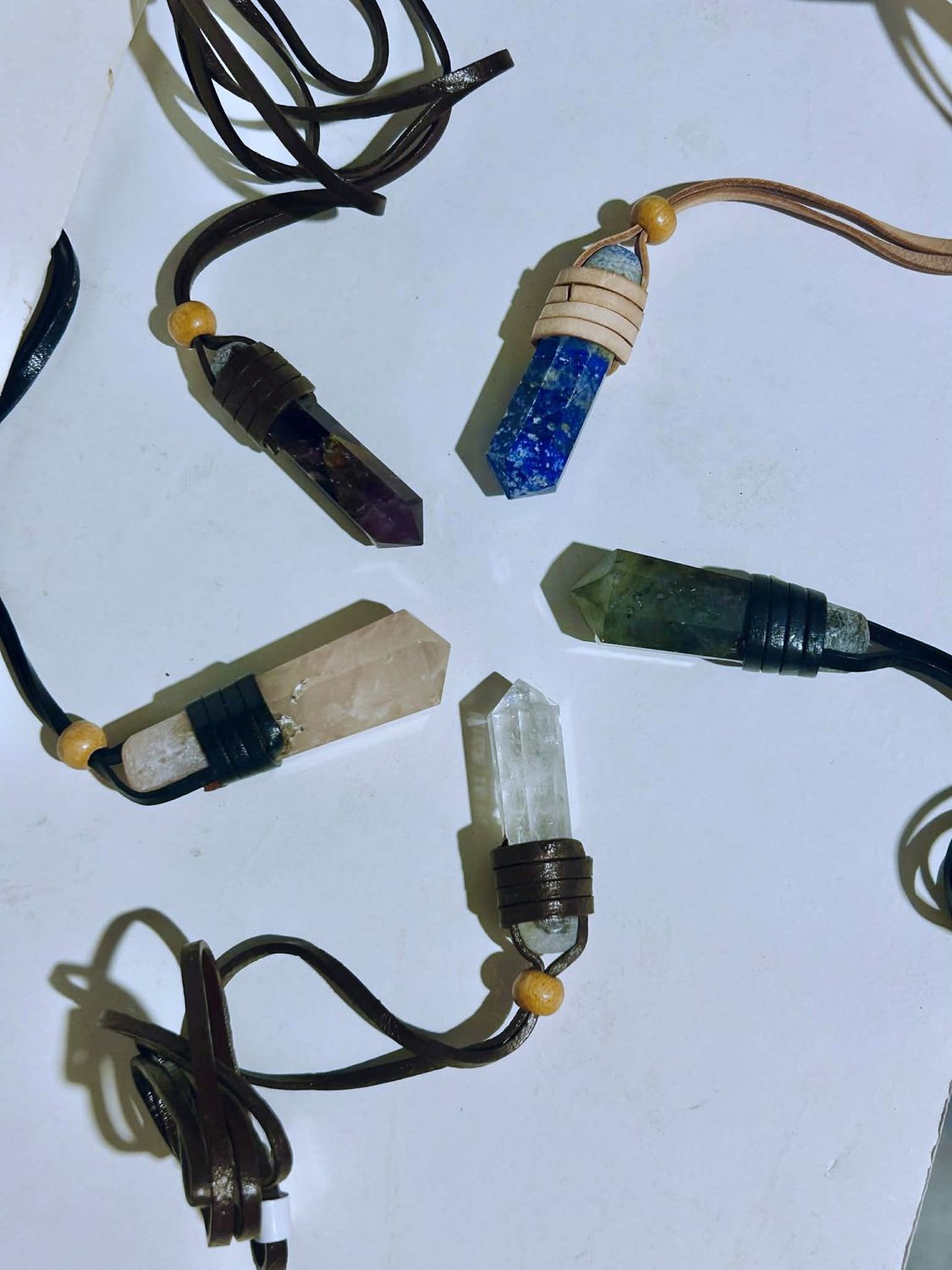 Leather wrapped crystal pendant