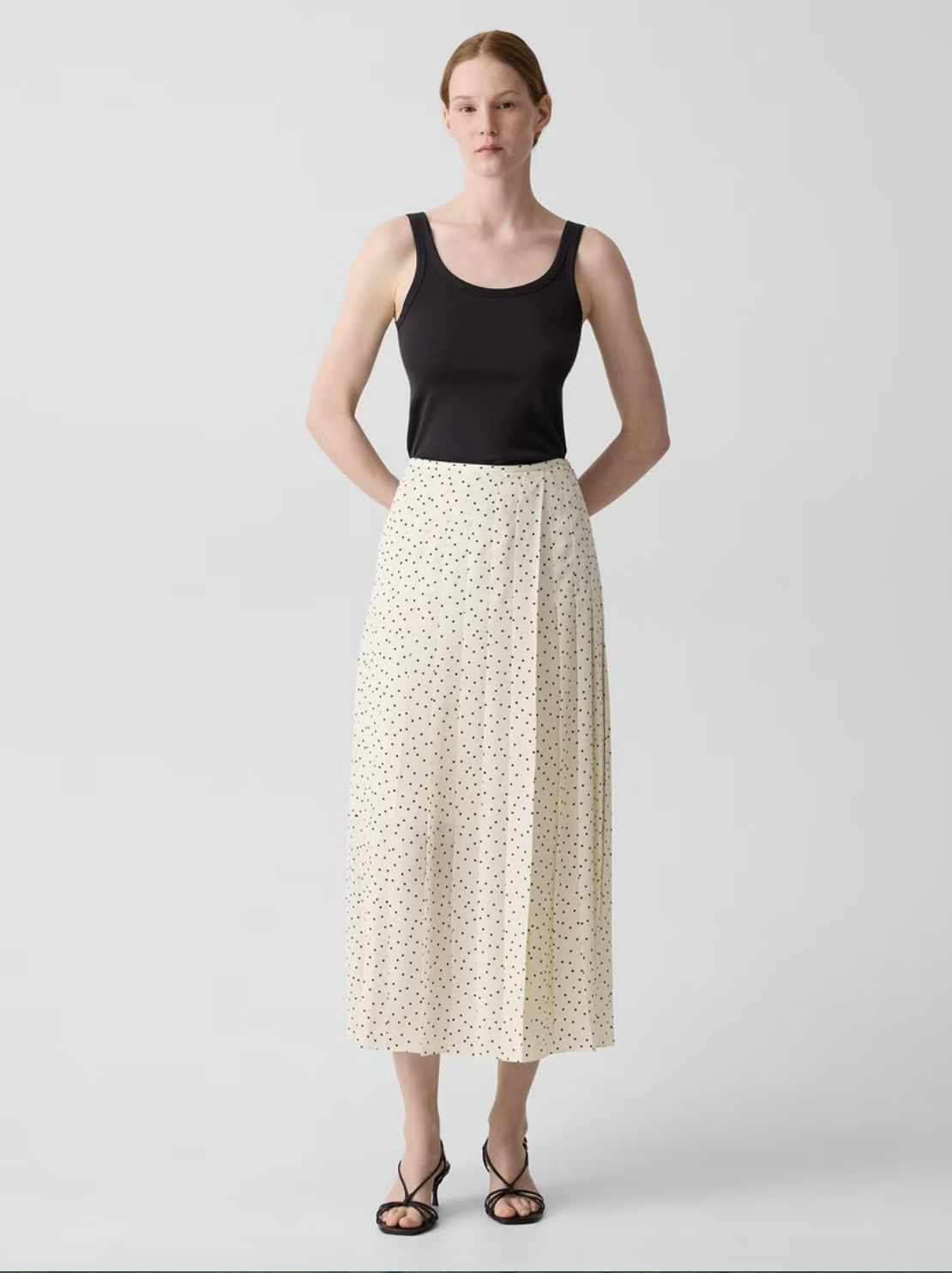 PLEATED WRAP SKIRT IN POLKA DOT GEORGETTE