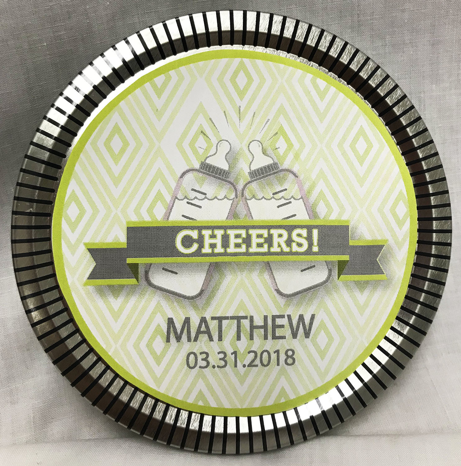 Green Baby Bottle Medallion Tin with Gourmet Milk Chocolate Wedges