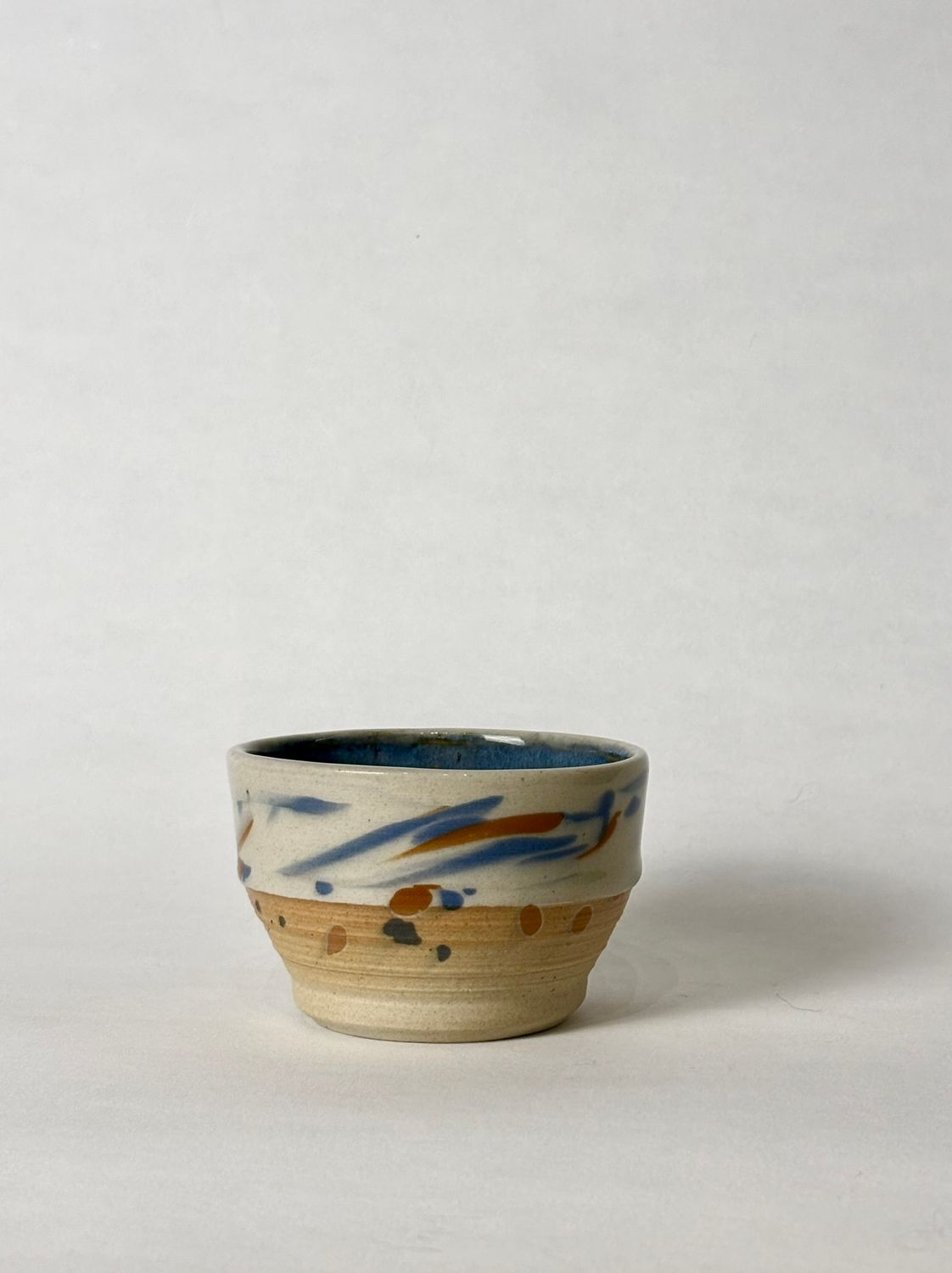 Flat white cup - Transparent glaze with colorful marks, with floating blue glaze inside