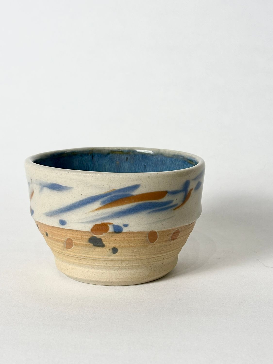 Flat white cup - Transparent glaze with colorful marks, with floating blue glaze inside