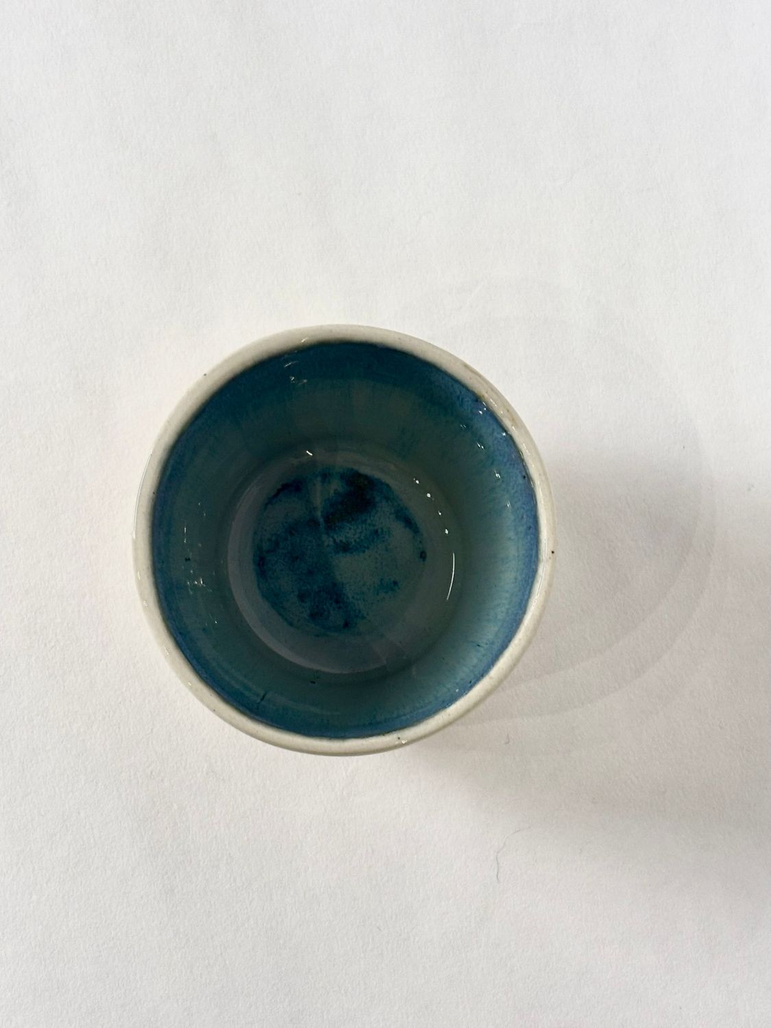 Flat white cup - Transparent glaze with colorful marks, with floating blue glaze inside