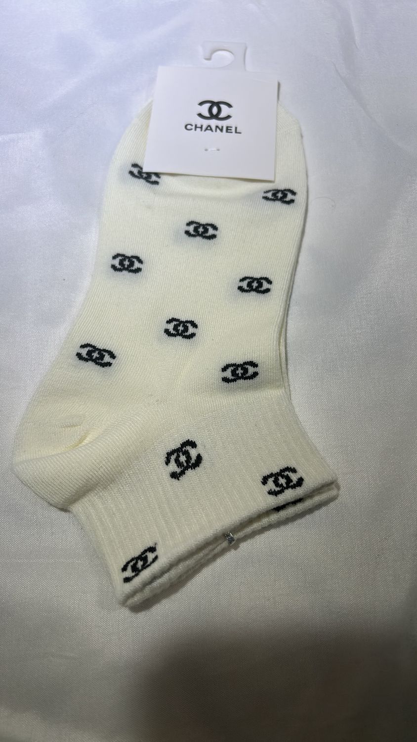 Socks, cream, and black Chanel 1