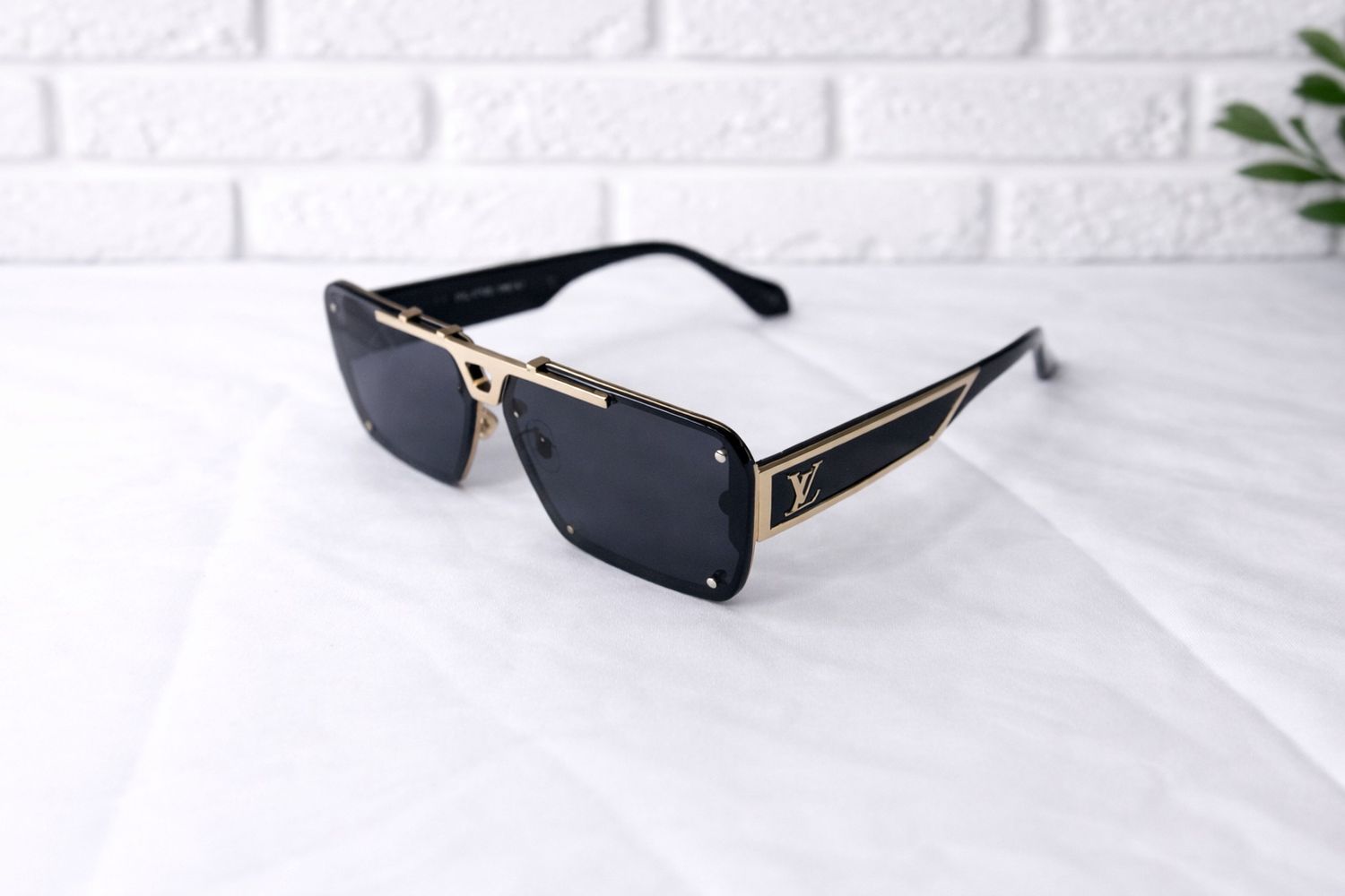 Black and gold LV sunglasses