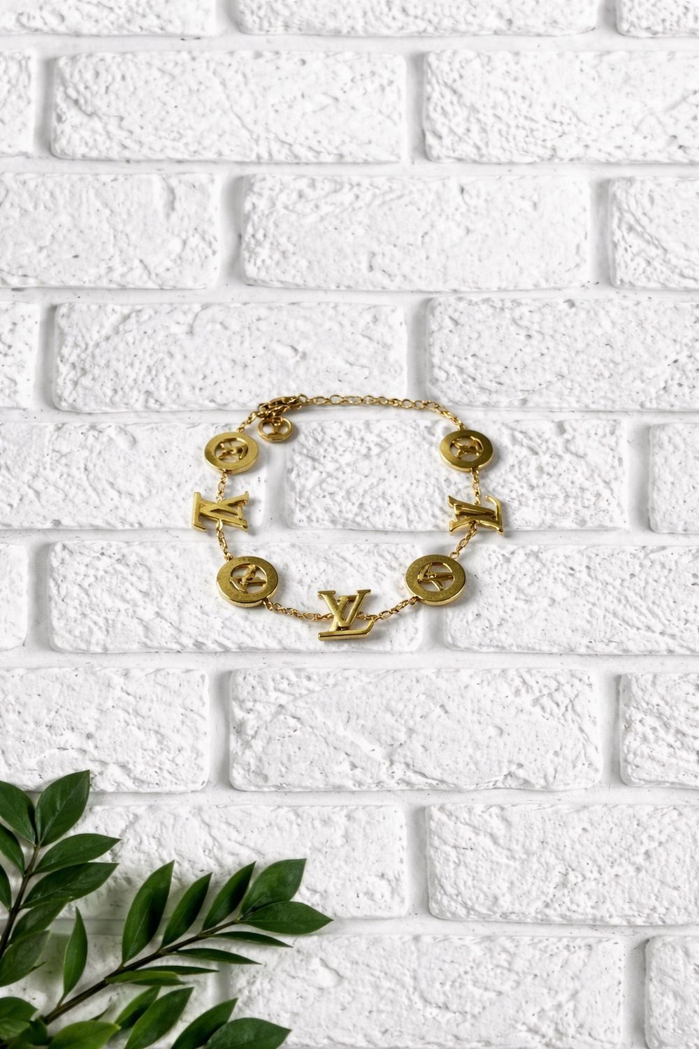 Gold in color LV  bracelet