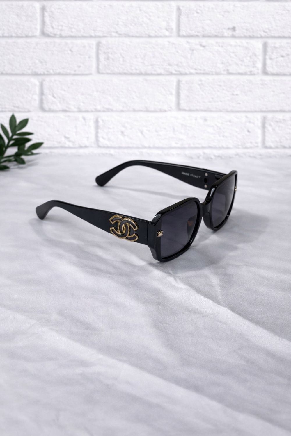 Black and gold cc sunglasses