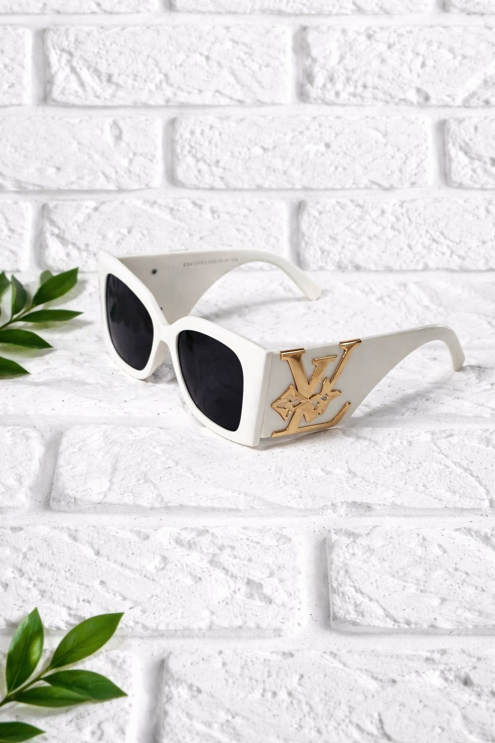 White and gold LV sunglasses