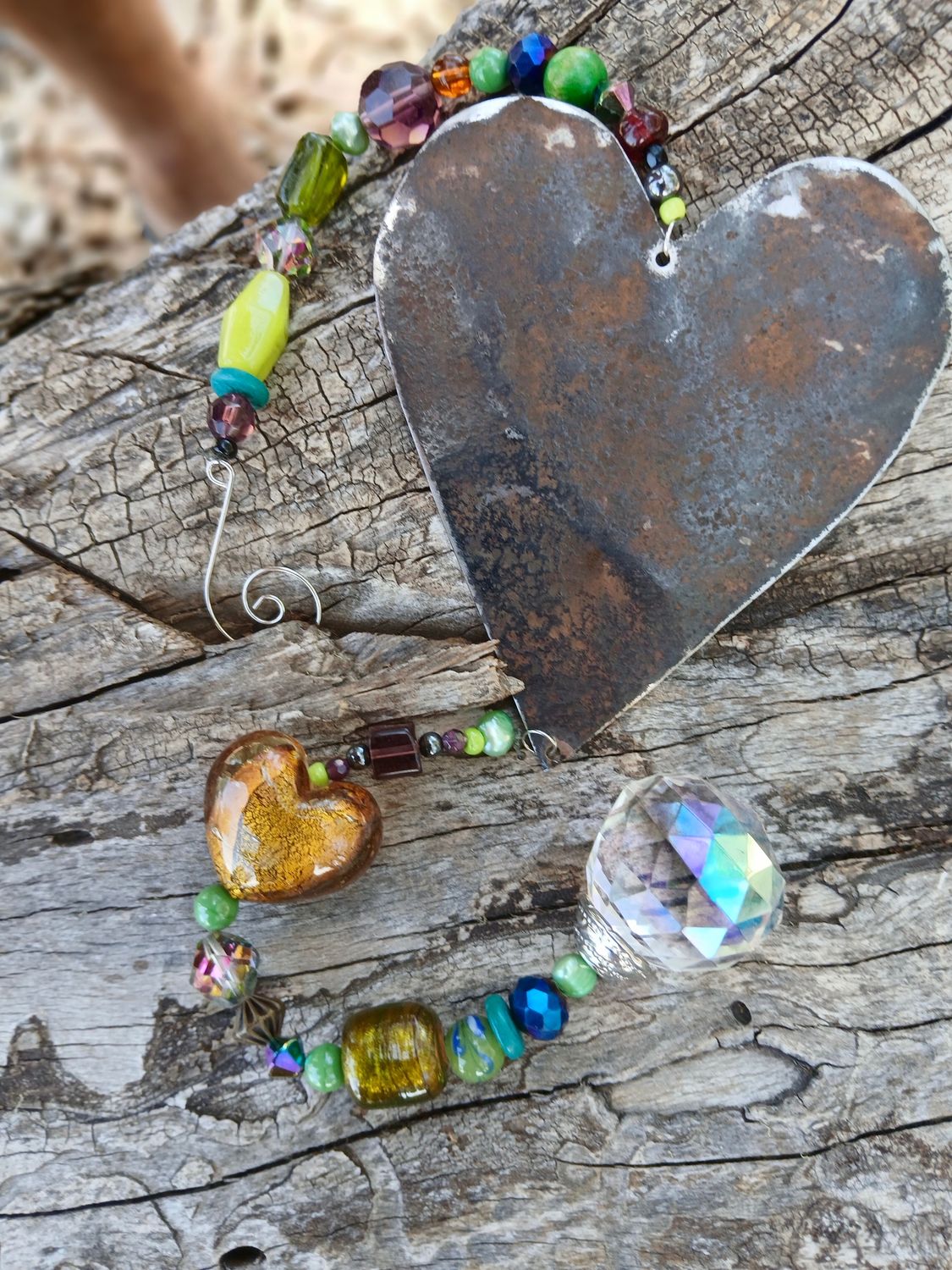 Treasures of the Enchanted Forest sun catcher with recycled metal heart created from early settlers water tanks, &amp; glass, crystal, beads
