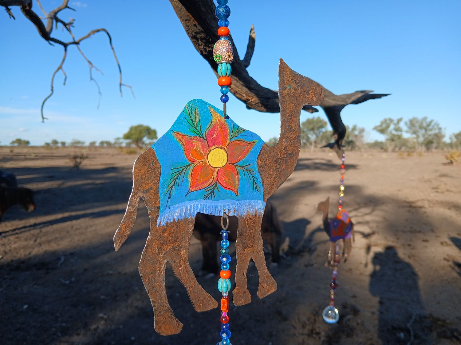 Kunkaa- Crow- Camel sun catcher with recycled metal heart - fill your life with rainbow sparkles