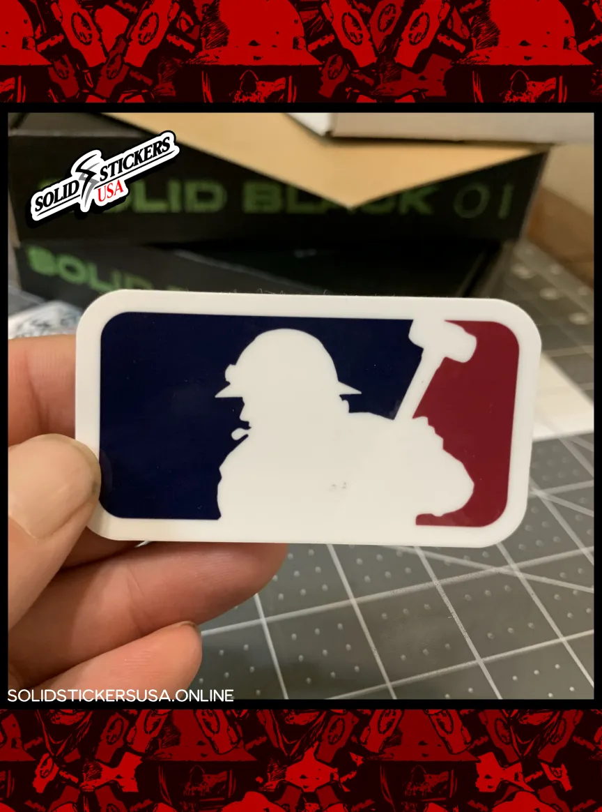 Hand holding a Major League Frac vinyl sticker featuring red white and blue frac worker silhouette with sledgehammer,