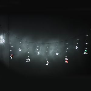 Luces tipo cascada estrellas y figuras blancas