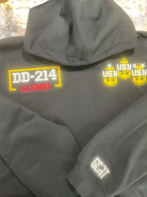 DD-214 Alumni Sweatshirt or Hoodie. "DD-214” lettering in white, “Alumni” in red (black lettering on red hoodies or sweatshirts) and with a gold border **Ships in 5-6 business days after ordered.