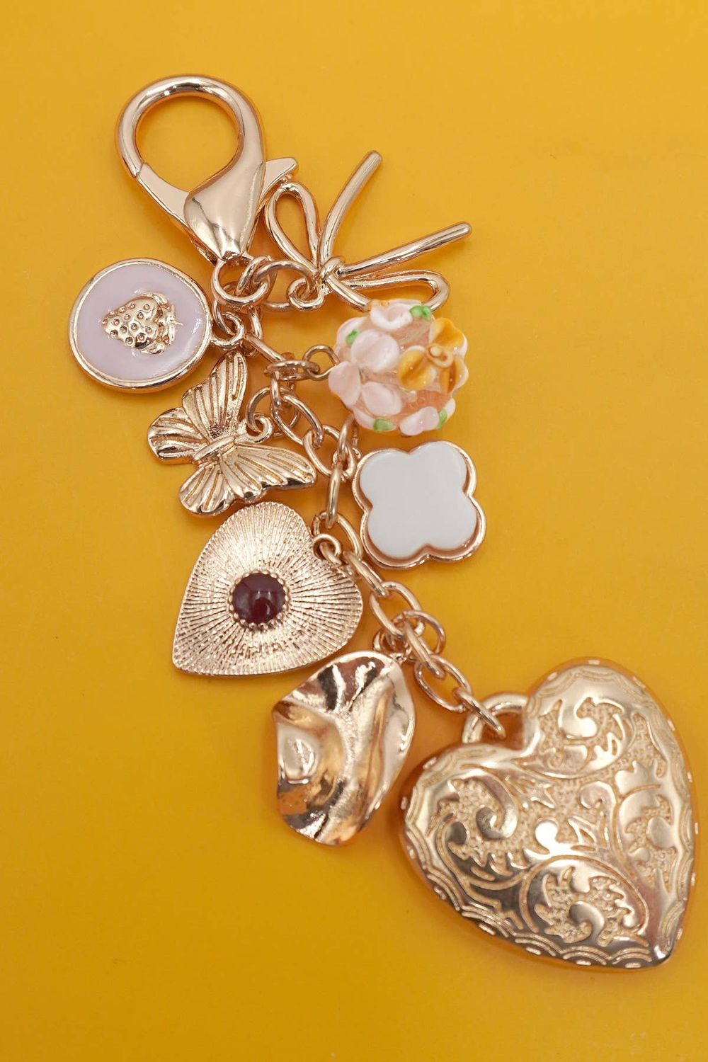 BAG CHARM BUTTERFLY CLOVER, Color: Gold