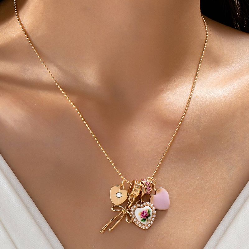 Multi Charm Porcelain Bow Ball Chain Necklace