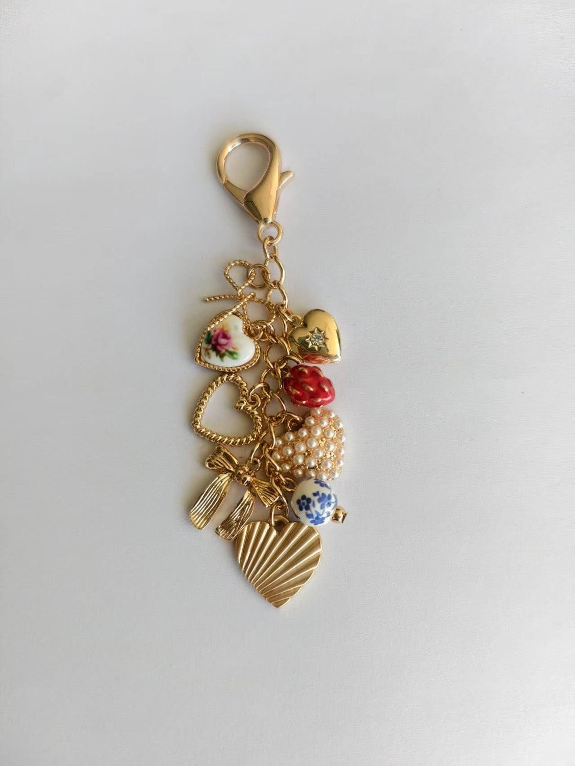 PORCELAIN BOWS  BAG CHARM, Color: Gold