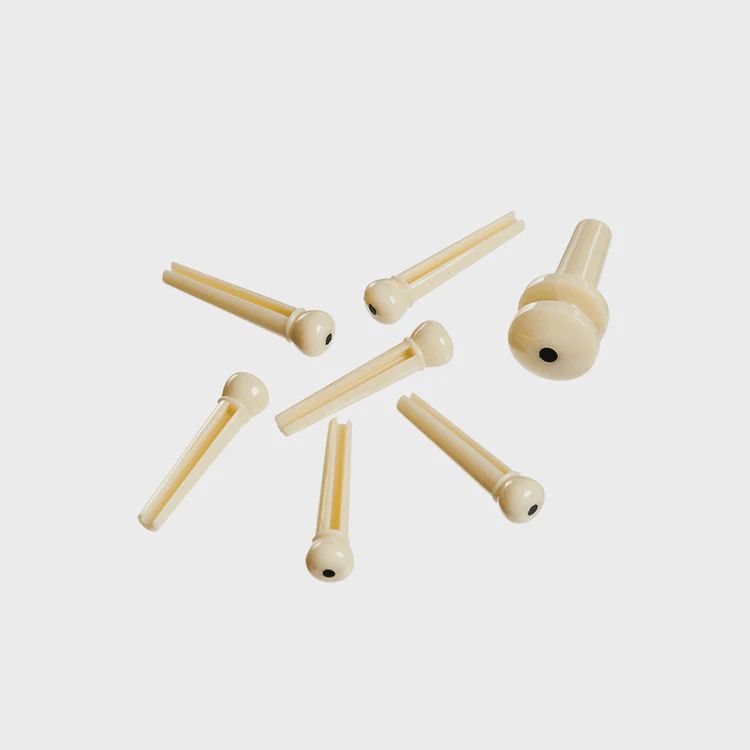 D'Addario Injected Molded Bridge Pins with End Pin, Set of 7, Ivory with Ebony Dot