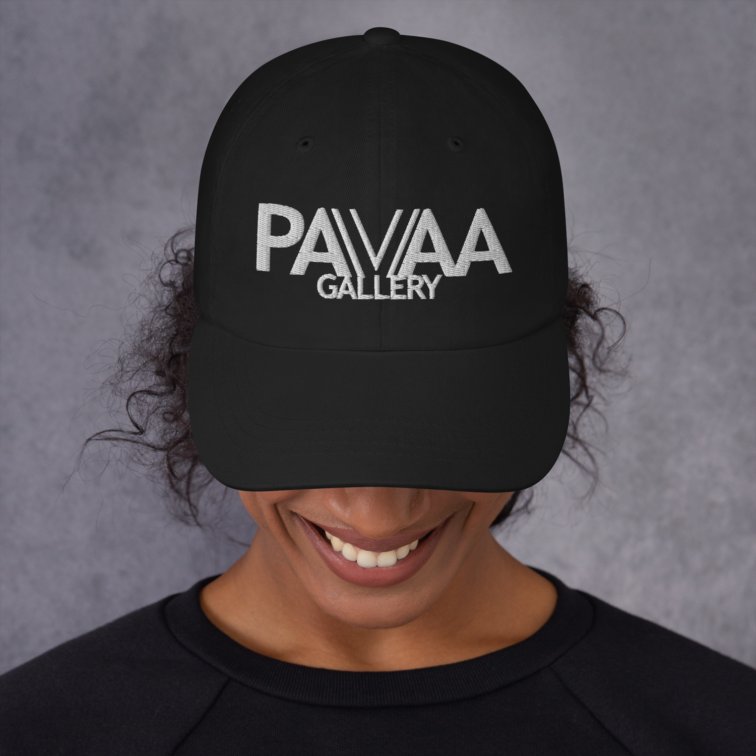 Official PAVAA logo in white on a black cap