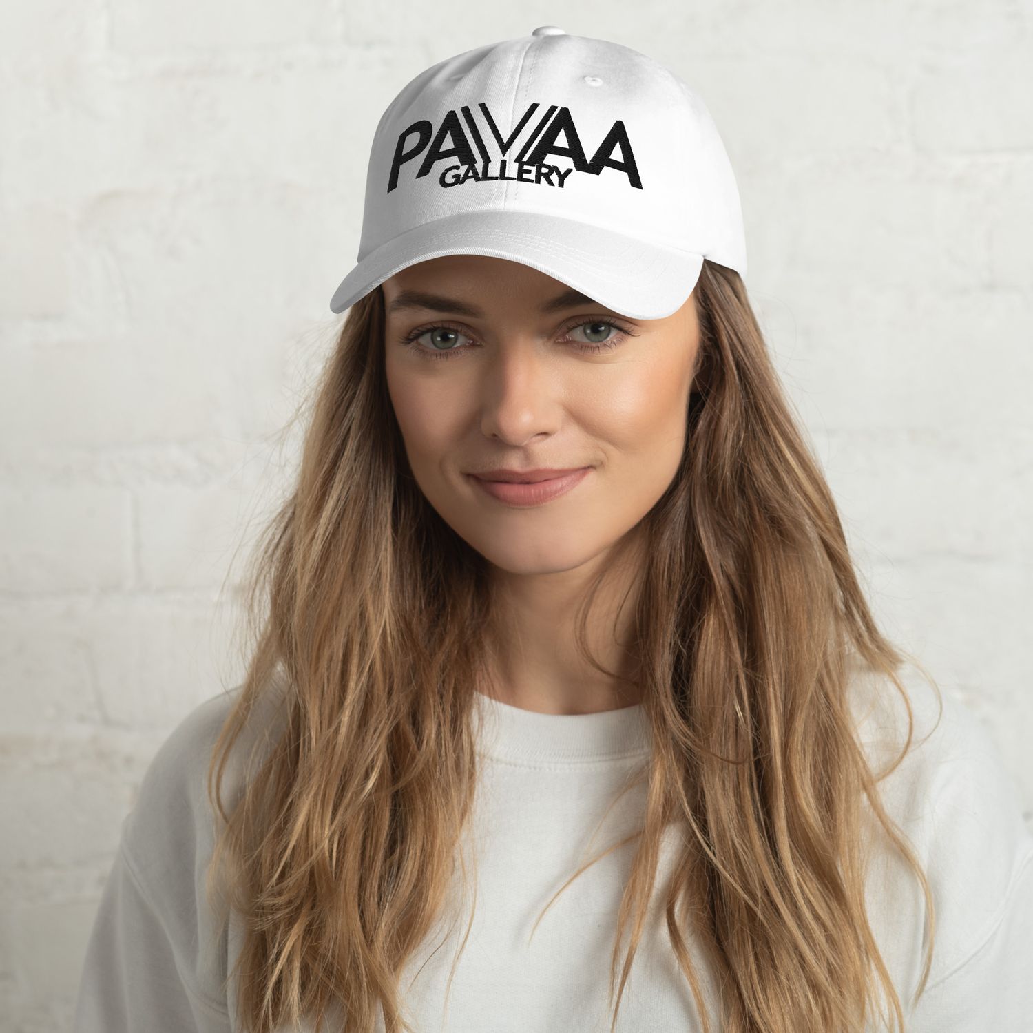 Official PAVAA logo in black on a white cap. Adjustable.