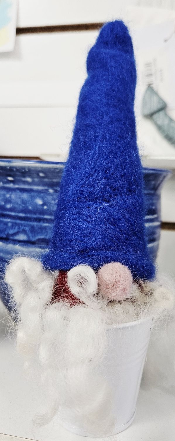 Gnome in a bucket with blue hat