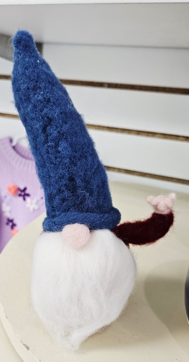 Red and blue gnome in a pot