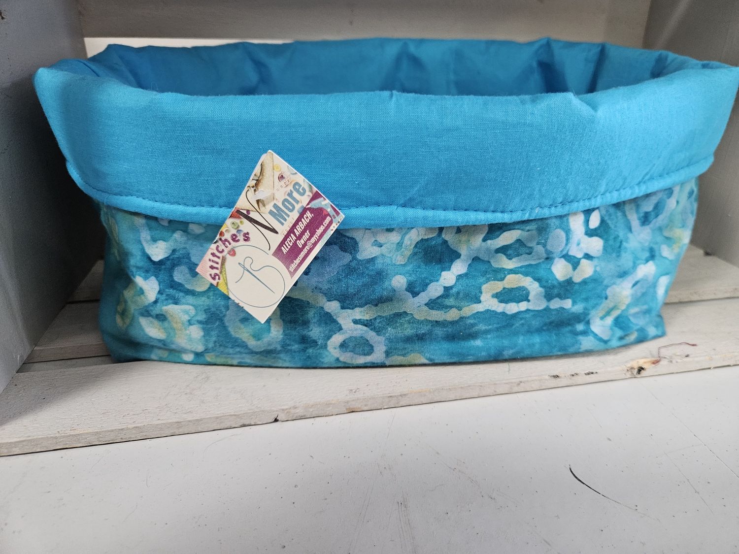 Blue/teal floral storage bin