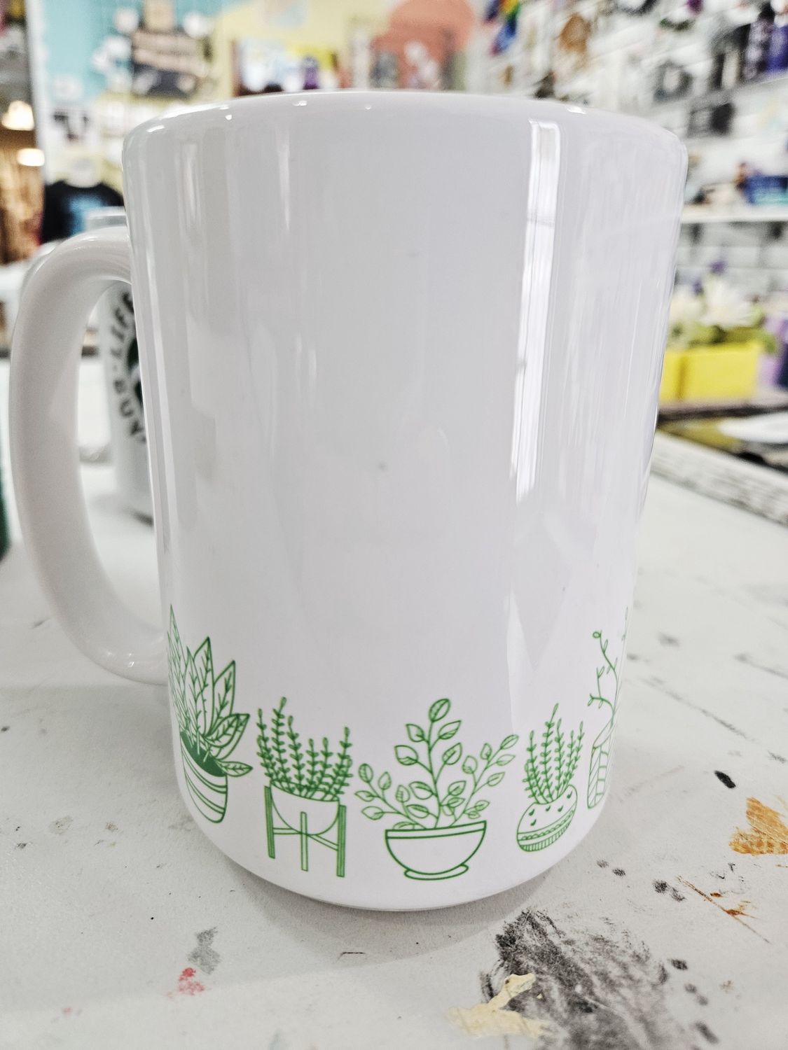 Plants around coffee mug