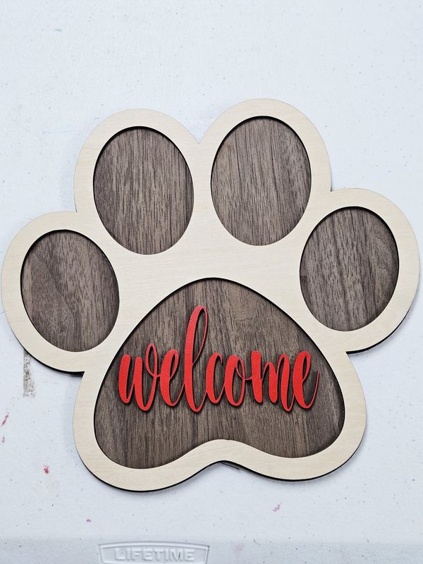 Paw print welcome sign red