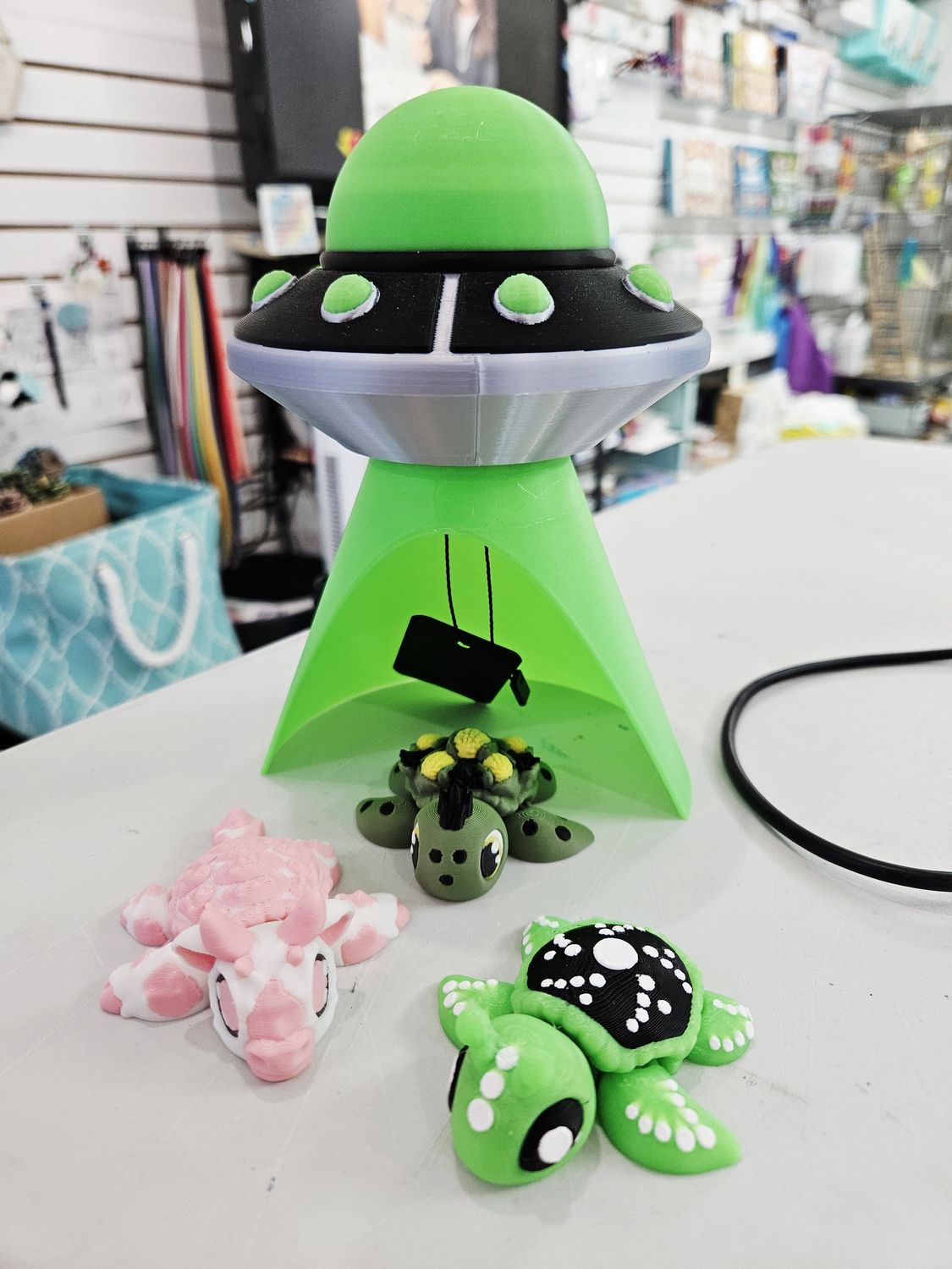 Glow in the dark spaceship with 3 turtle animals