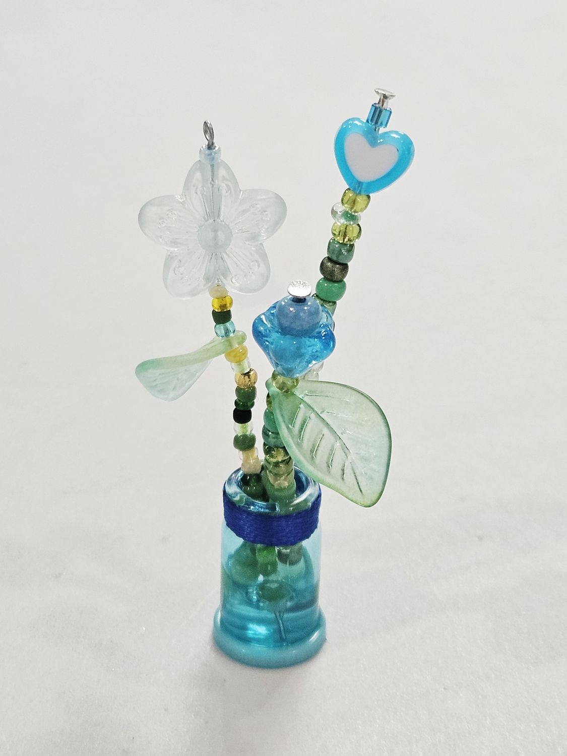 Blue beaded flowers in mini blue vase